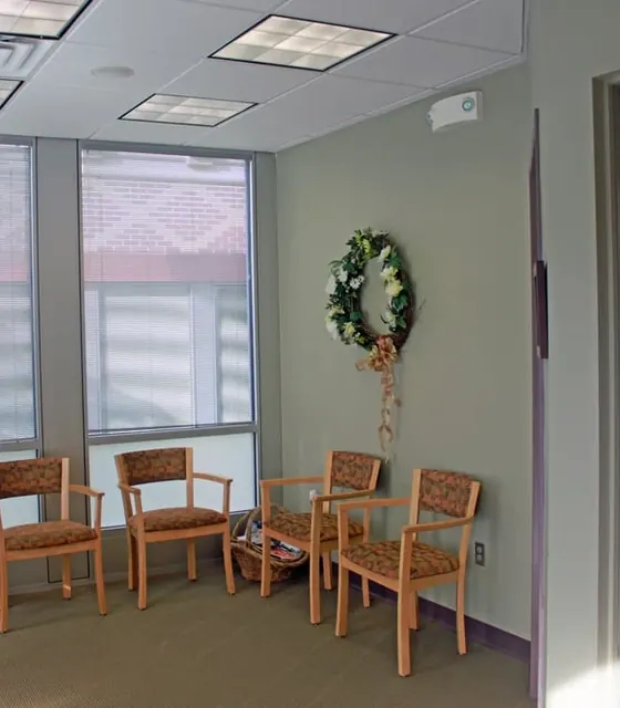 Chairs by the windows in the waiting room.